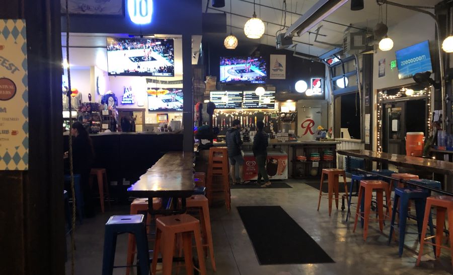 The indoor seating area and taphouse at Midtown Yacht Club.