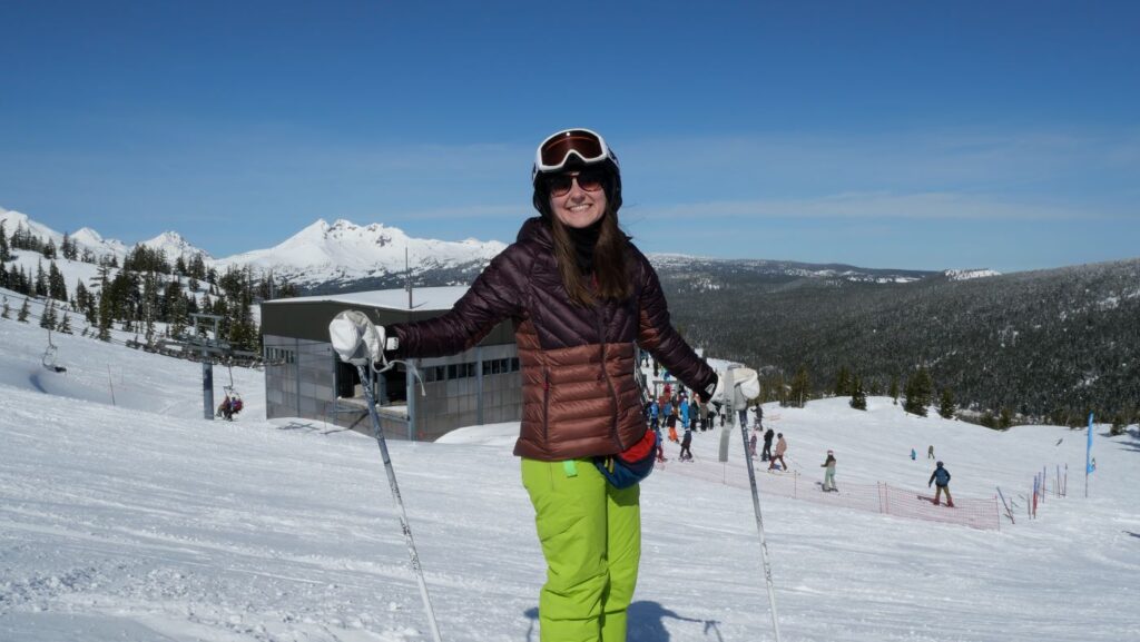 A skier enjoying a sunny day on Mount Bachelor.