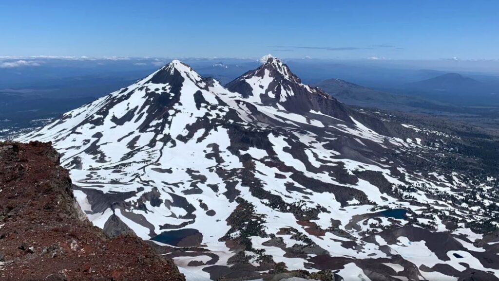 The views of Middle and North Sister from the top of South Sister.