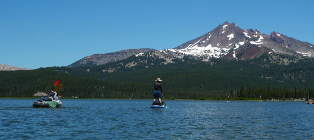 Kayaking and paddleboarding near Bend Oregon at Sparks Lake.