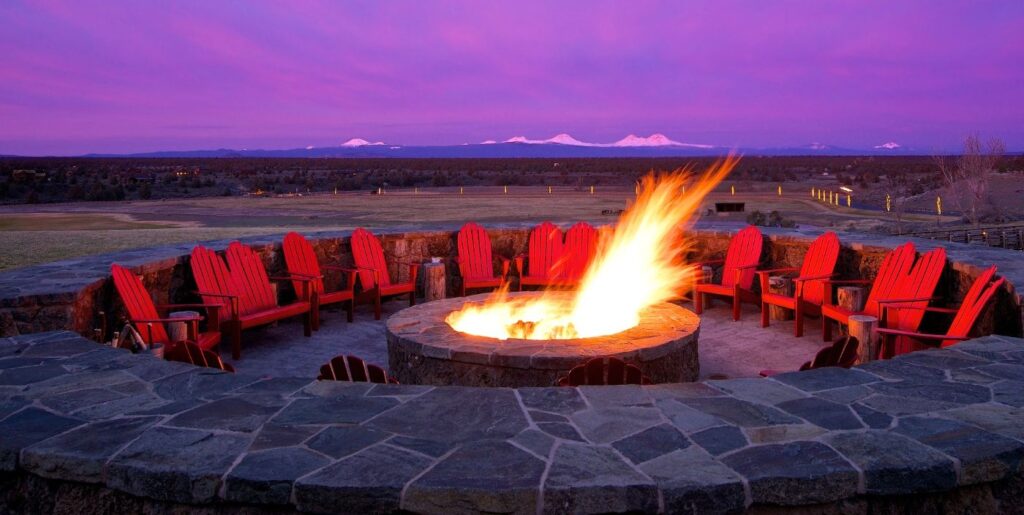 A beautiful sunset and bonfire at Brasada Ranch, one of the best resorts near Bend Oregon.