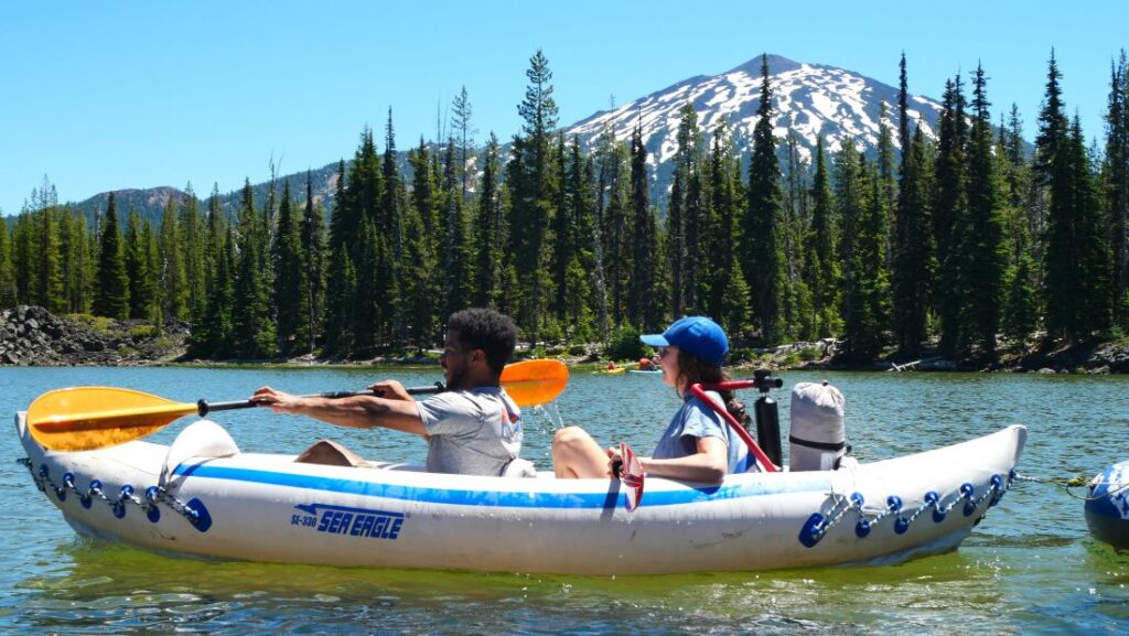 People kayaking on Sparks Lake in Oregon.