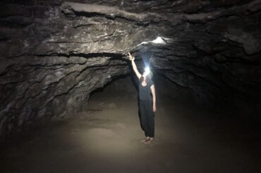 A visitor exploring one of the Redmond Caves. This is one of our favorite caves near Bend.