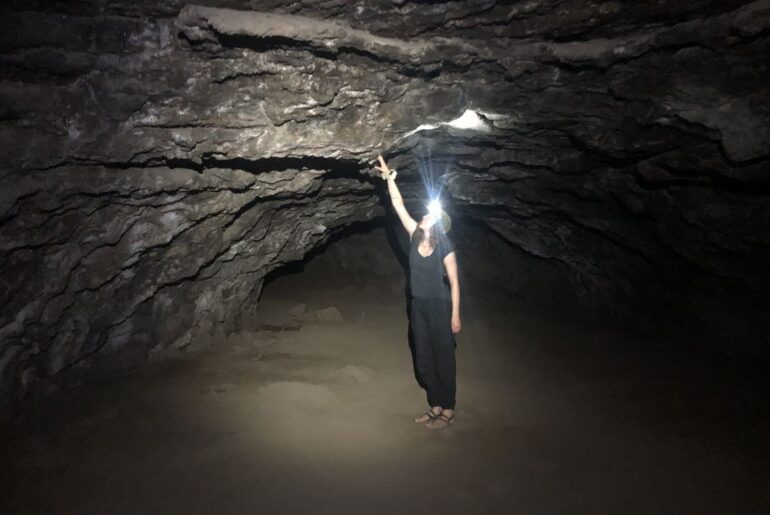 A visitor exploring one of the Redmond Caves. This is one of our favorite caves near Bend.