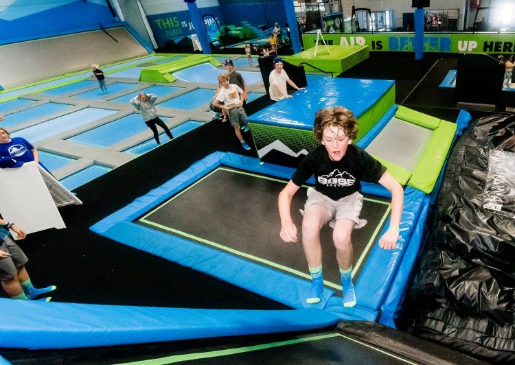 Kids bouncing on trampolines at Mountain Air Indoor Trampoline Park in Bend Oregon.