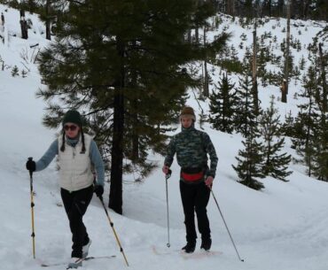 Two people cross-country skiing at Three Creek Snow Park