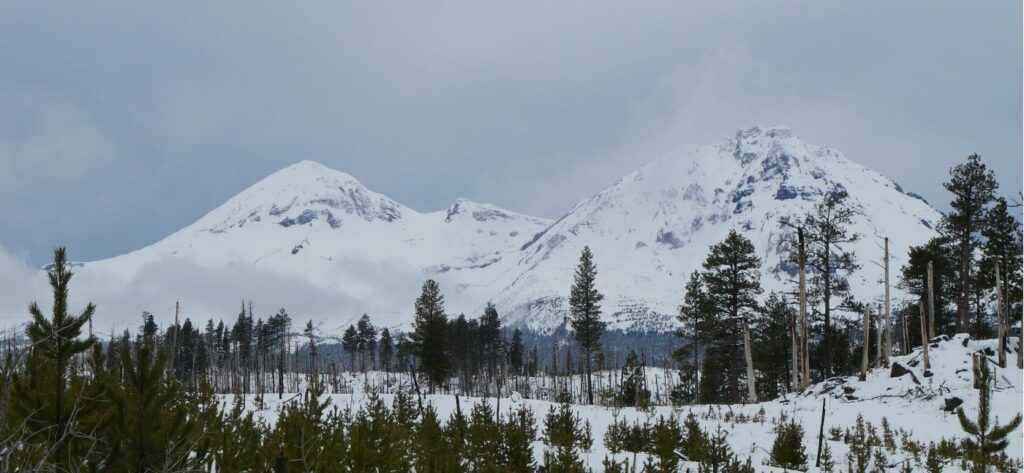 The view of the Three Sisters Mountains from Three Creek Snow Park.