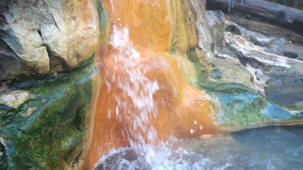 A small waterfall flowing into the main soaking pool at Umpqua Hot Springs.