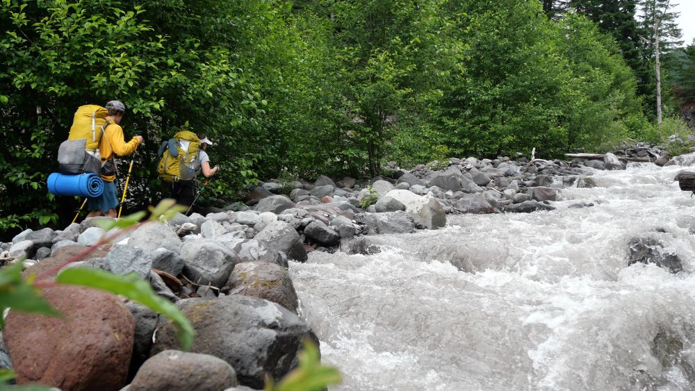 Us passing a silty stream on the Wonderland Trail.