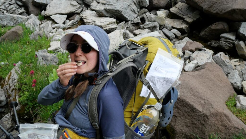 Abby carrying our wilderness permit, which must be visible on your pack and tent.