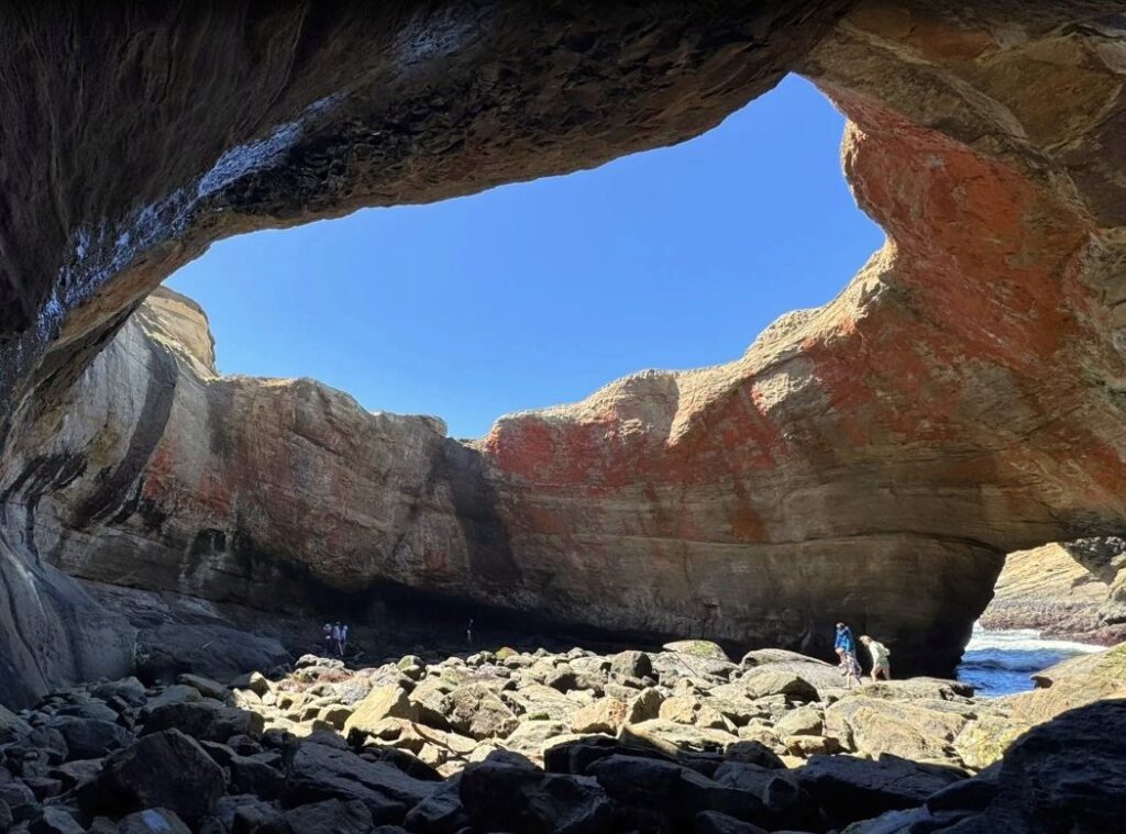 Views from inside of Devil's Punchbowl at low tide on a sunny day.