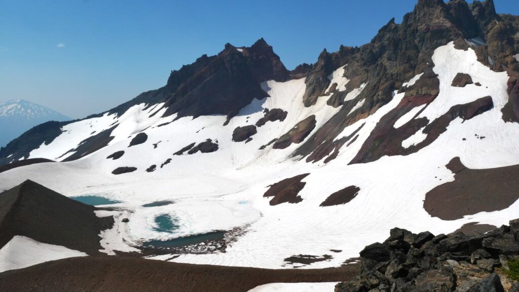 Views of No Name Lake in late July when it is mostly iced over.