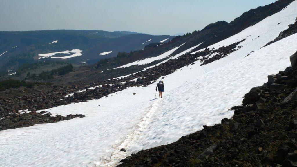 Abby traversing a snow field on the Tam McArthur Rim Trail.