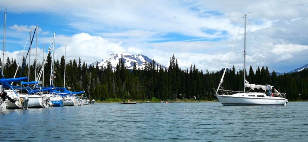 Boats on Elk Lake Oregon with South Sister in the background.