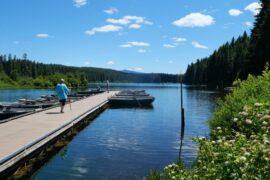 A person walking along the dock at Clear Lake Resort Oregon.