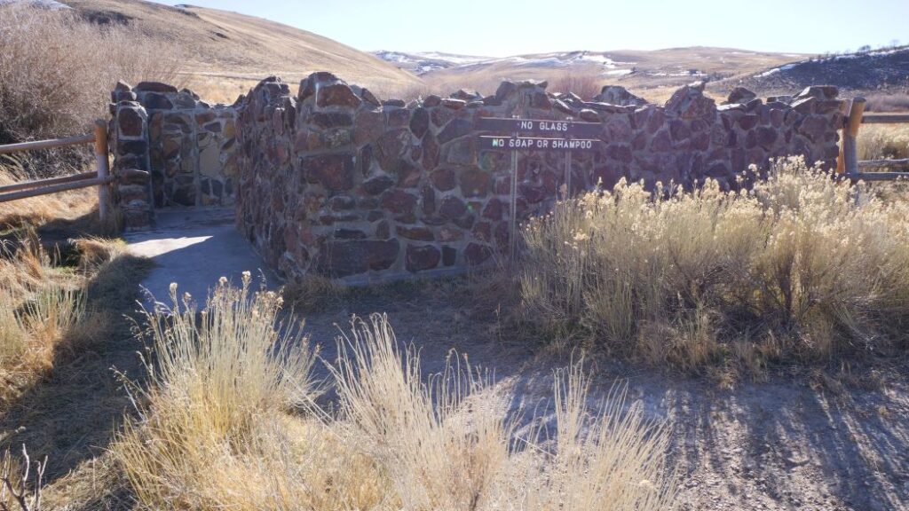 The rock wall surrounding the constructed pool at Hart Mountain Hot Springs.