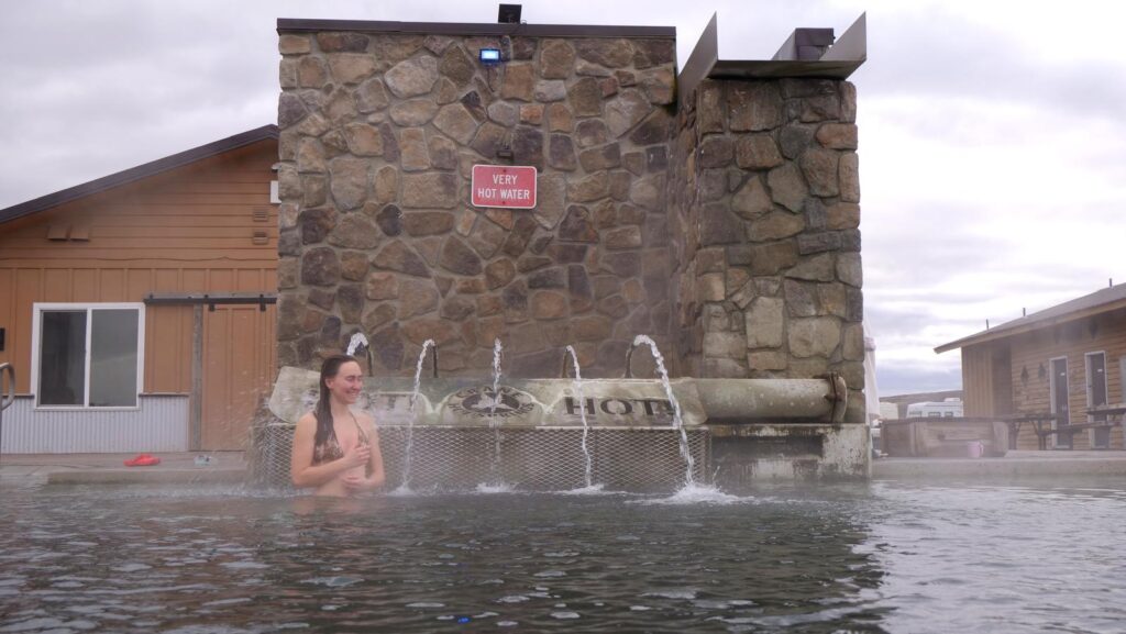 Abby braving the water jets at Crane Hot Springs.