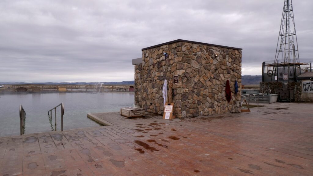 Railings and concrete ramps help folks enter the soaking pond.