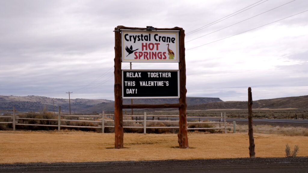 The entrance sign at Crane Hot Springs.