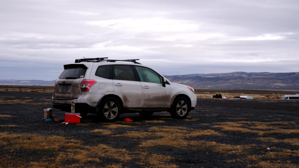 Our car set up for camping in the gravel lot.