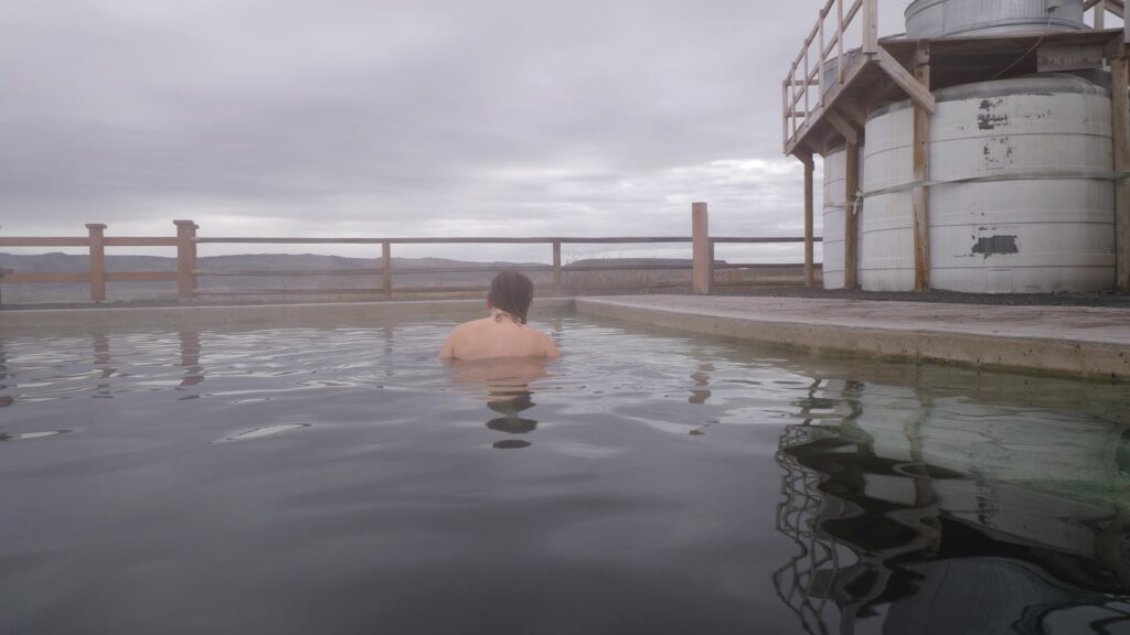 Abby enjoying a relaxing soak at Crane Hot Springs.